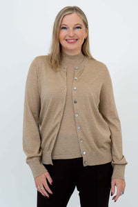 Blonde woman modeling a beige merino wool cardigan open over a beige top