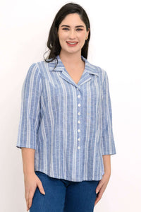 Woman wearing blue and white striped button-up top with collared neckline