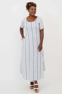 Model wears a blue and white striped maxi dress with short sleeves and pockets