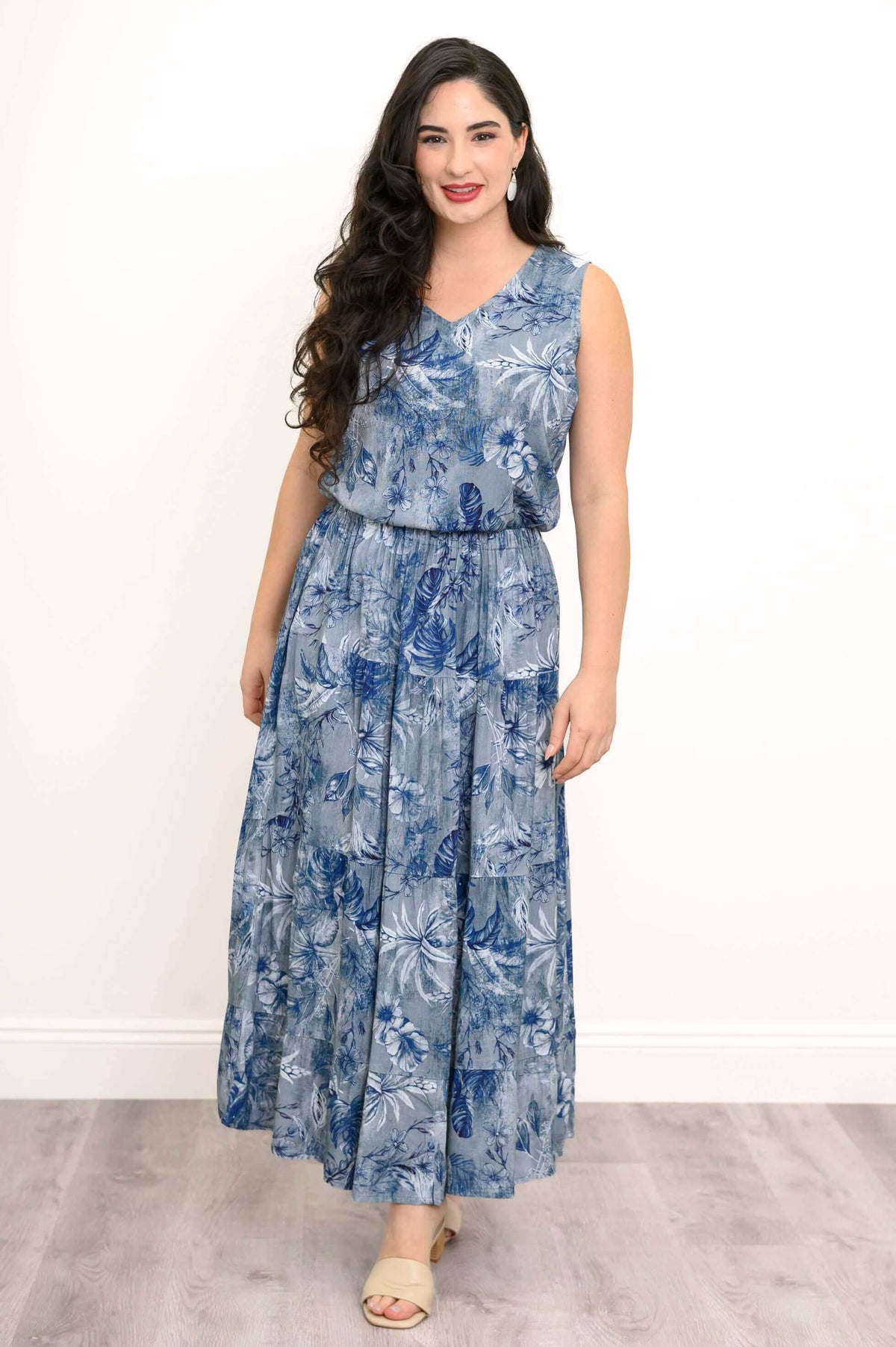 Model styling blue botanical tank top and skirt with gathered waist