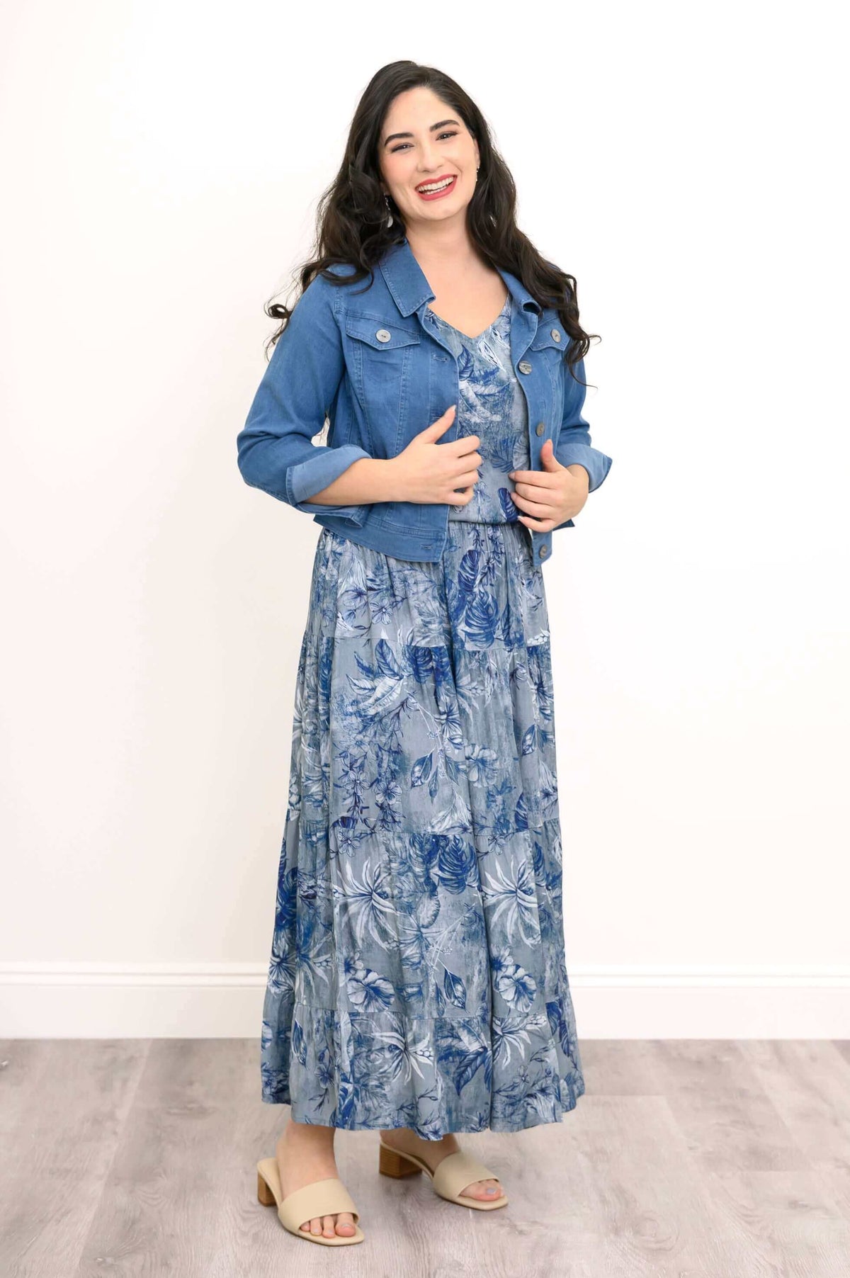 Model wearing blue botanical tank and skirt with a blue denim jacket