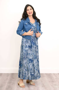 Model wearing blue botanical tank and skirt with a blue denim jacket