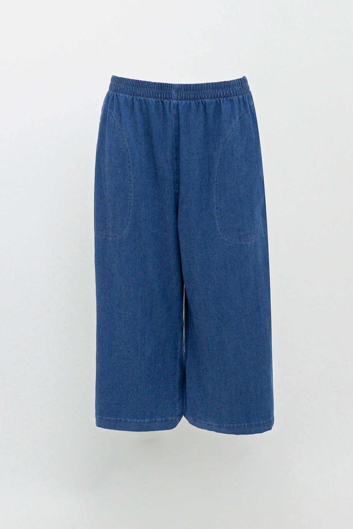 Blue denim Tencel capris with elastic waistband and front pockets on white background