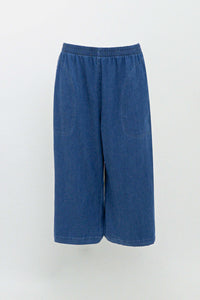 Blue denim Tencel capris with elastic waistband and front pockets on white background