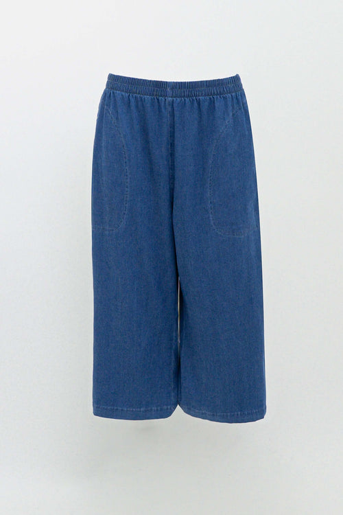 Blue denim Tencel capris with elastic waistband and front pockets on white background