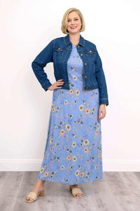 Model in blue floral maxi dress styled with a denim jacket