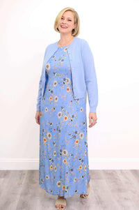 Model with blond hair in a blue floral maxi dress and light blue cardigan