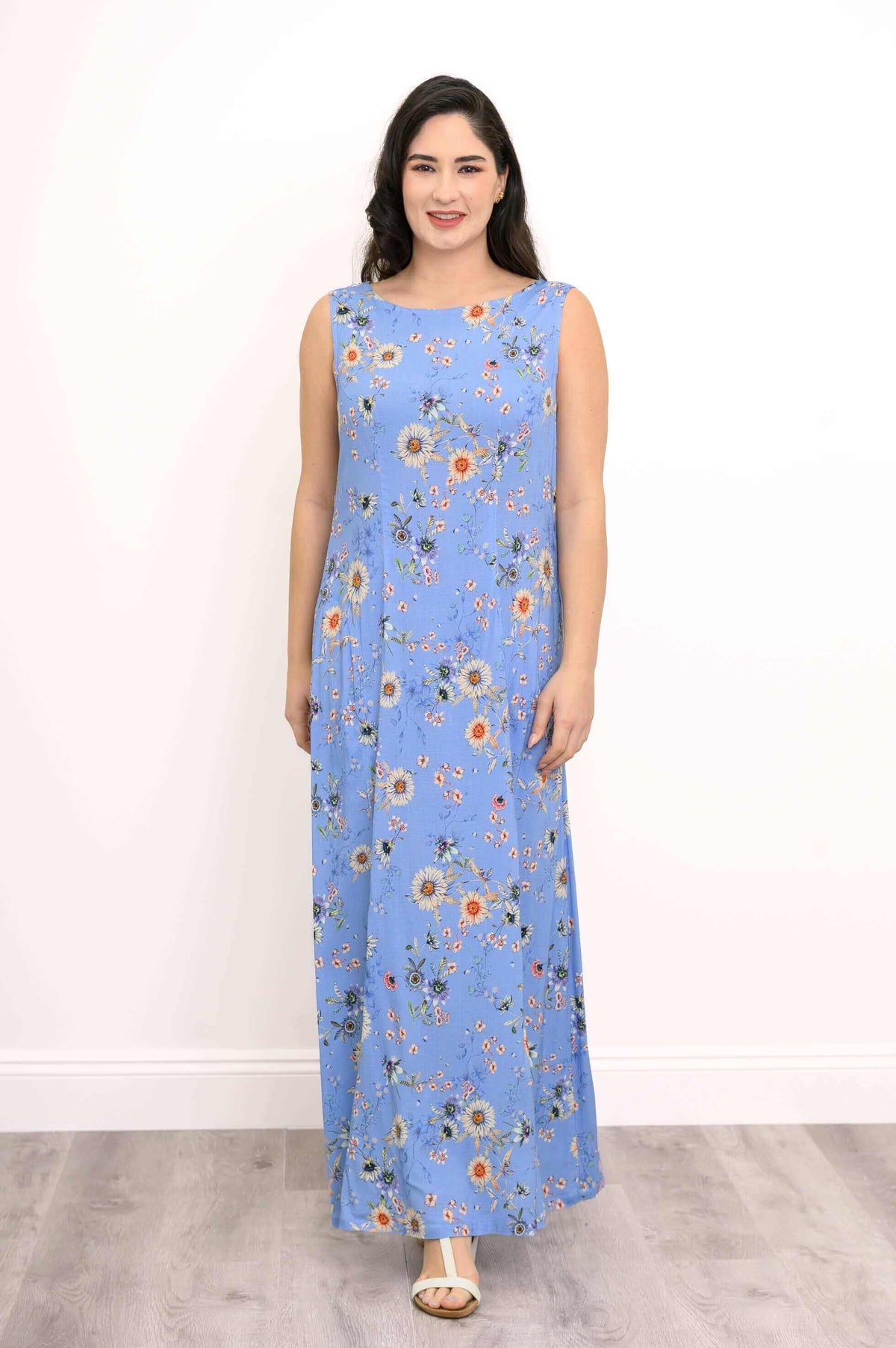 Front view of model in blue floral sleeveless maxi dress