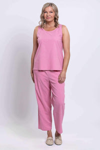Full length front view of Boardwalk Pants in pink on model with matching top