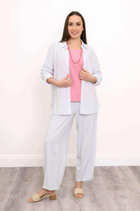 Model wearing Boardwalk Pants with a pink top and light button-up shirt