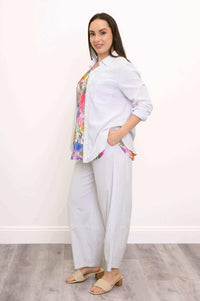 Model in Boardwalk Pants with floral top and white shirt, side view