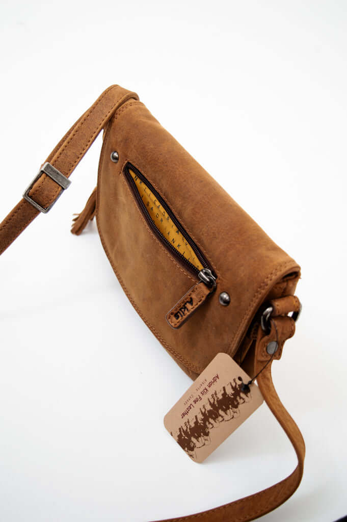 Brown leather crossbody bag top view showing zipper and yellow lining