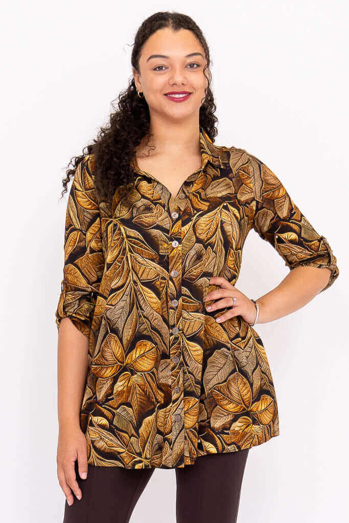 Front view of a woman wearing a Celine Oversized Tunic with brown botanical print