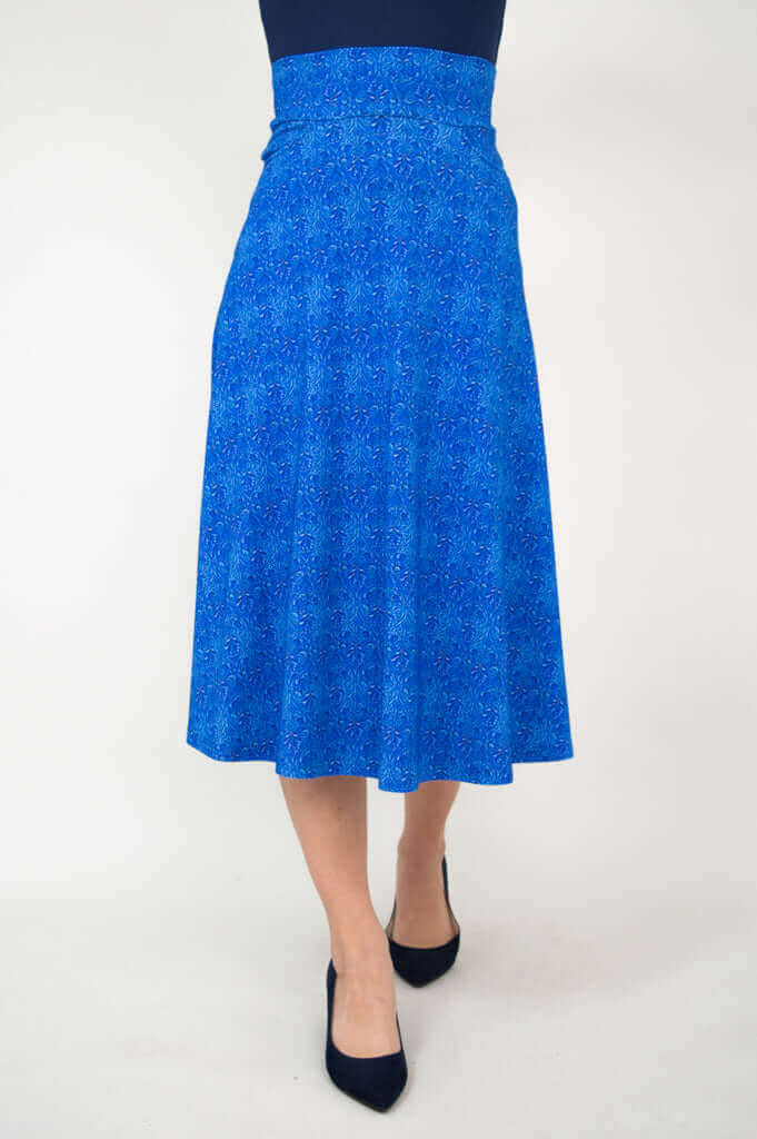 Front-centered view of a blue patterned mid-calf skirt on a model