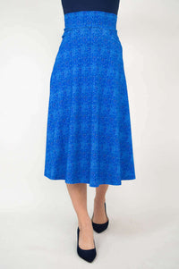 Front-centered view of a blue patterned mid-calf skirt on a model