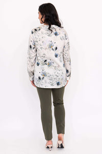 Back view of woman wearing Charlotte Blouse with blue floral print