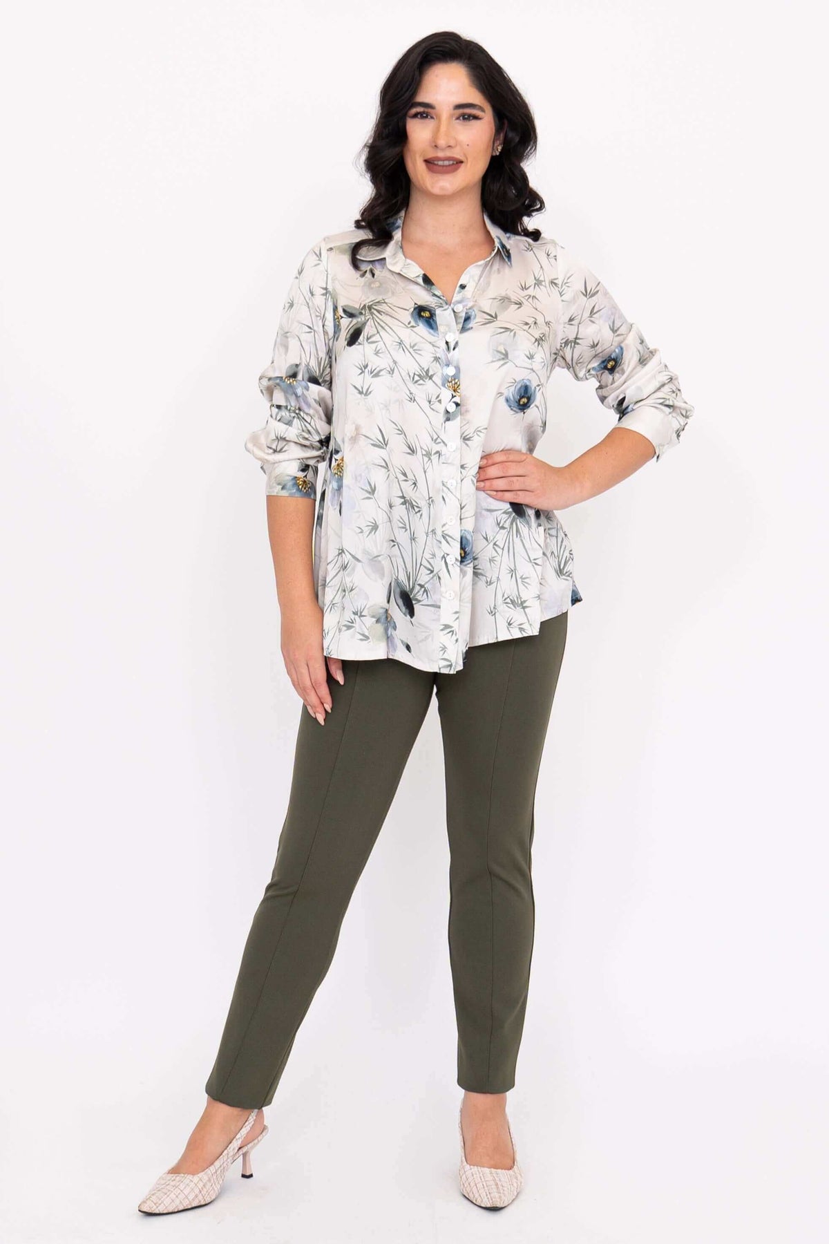 Woman modeling Charlotte Blouse with sleeves rolled up and hand on waist