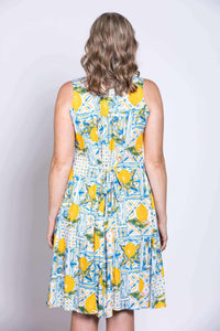 Close-up back view of dress showing tie-back detail and lemon print design