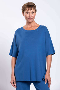 Close-up front view of blue crew neck sweater with short sleeves