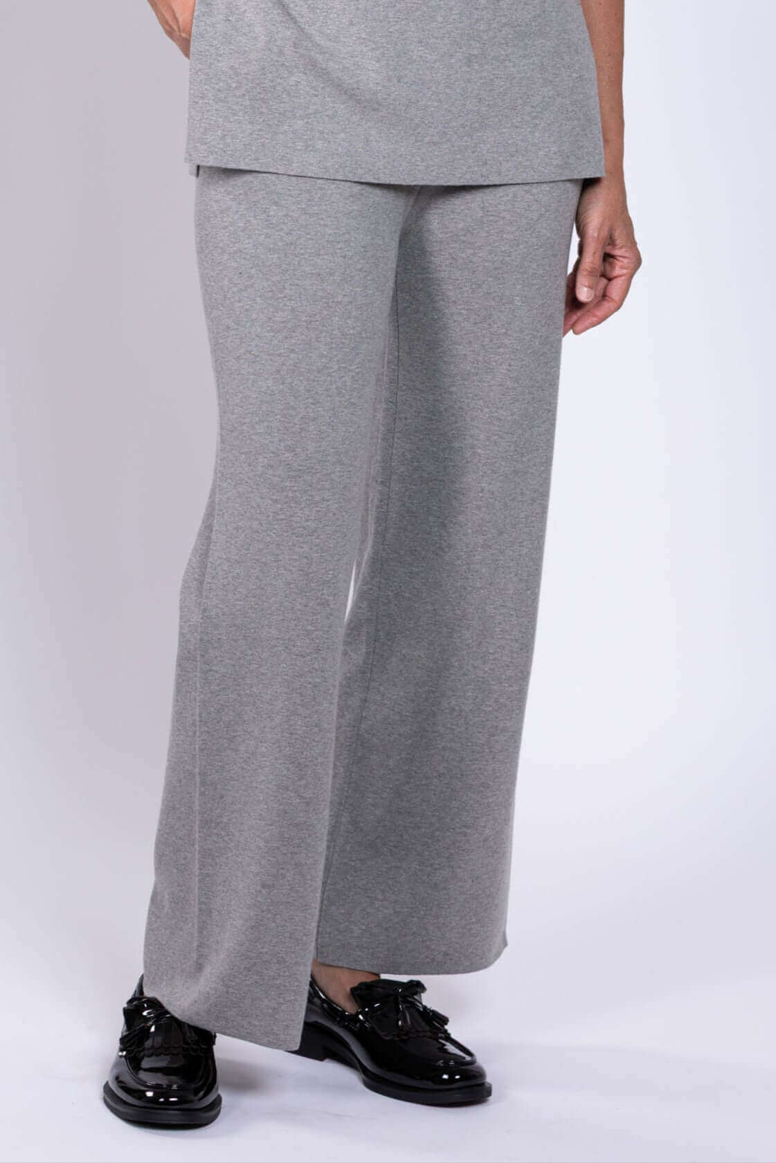 Close-up front view of grey Bailey track pants with straight-leg cut