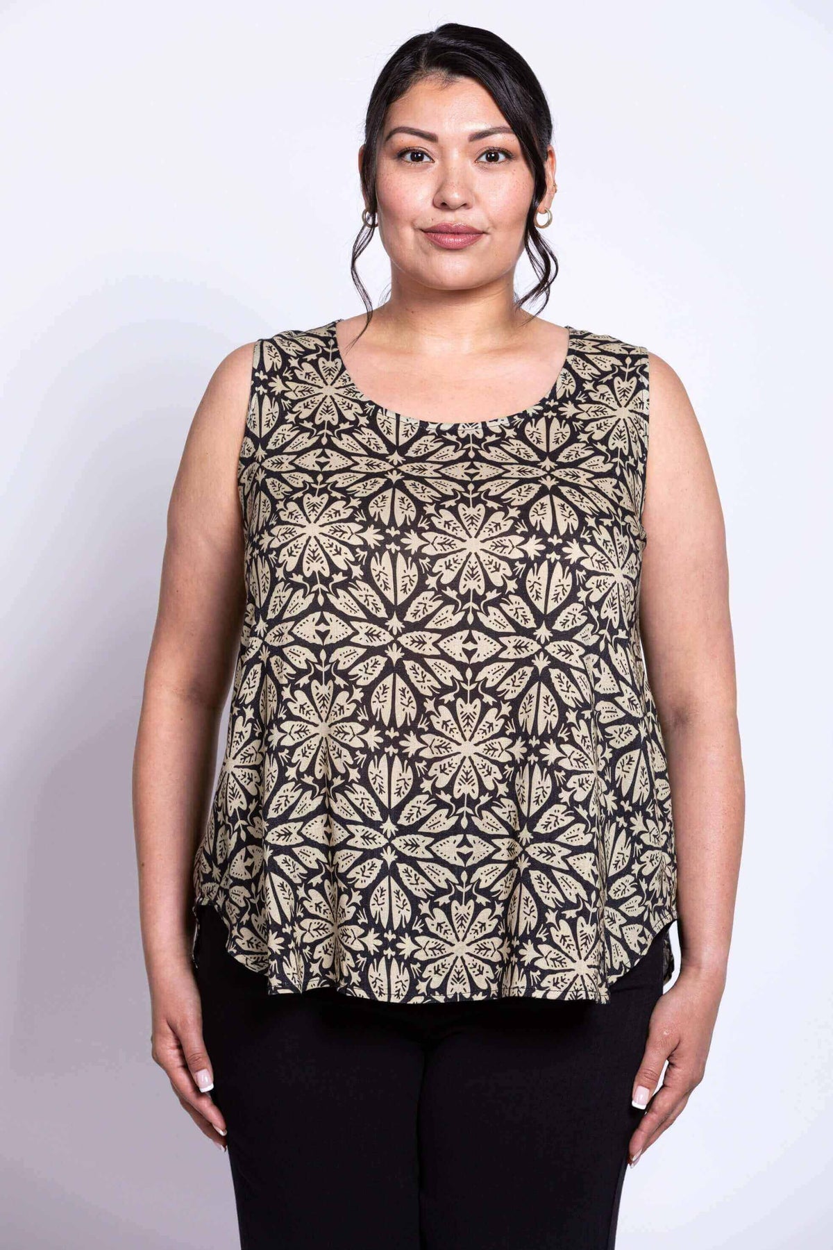 Close-up front view of model wearing black floral sleeveless tank top