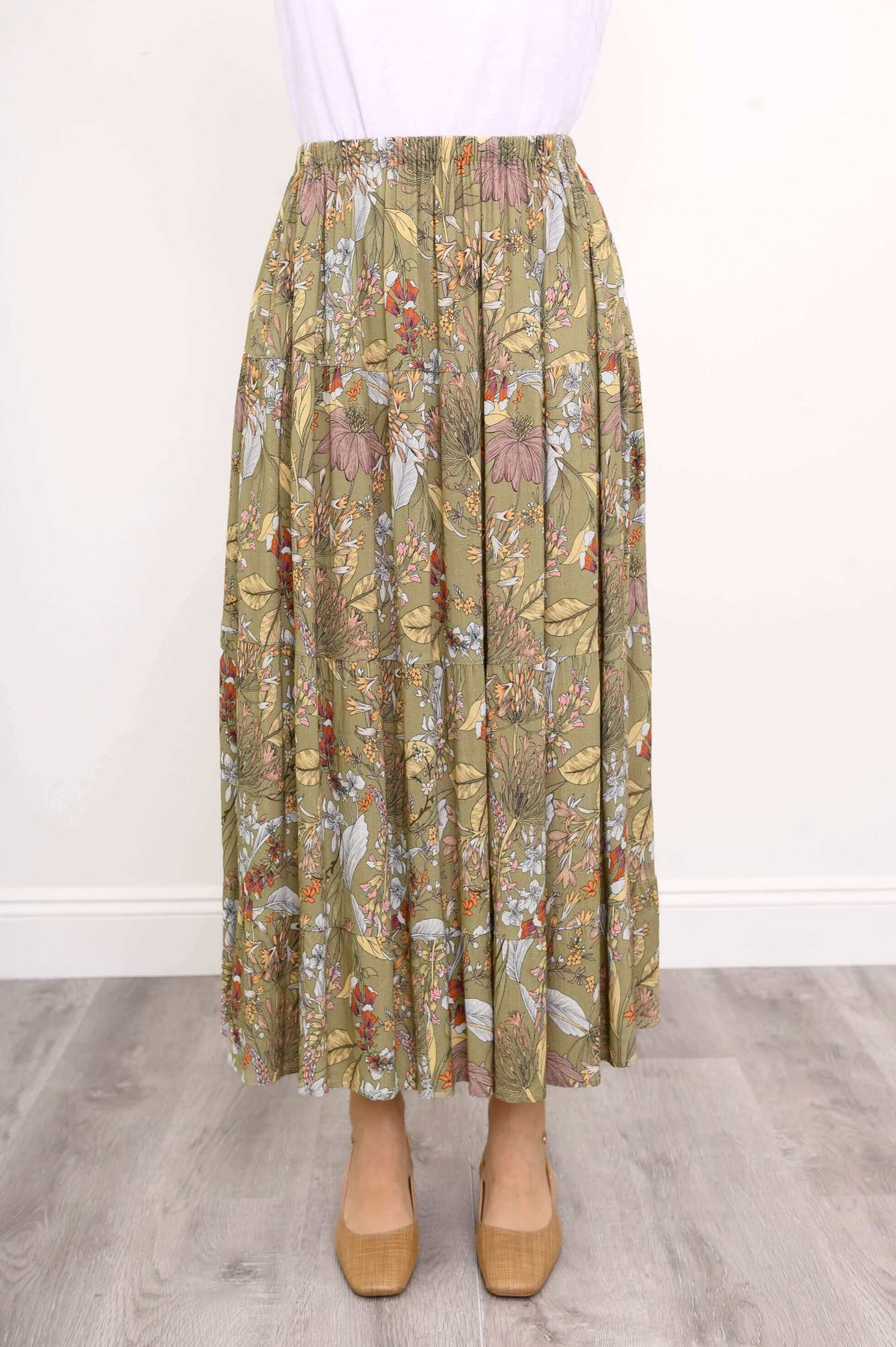 Close-up of tiered floral skirt details and elastic waistband
