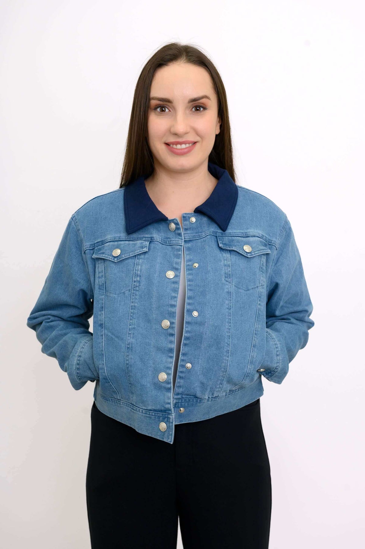 Close-up of woman in The Gerry jean jacket showing front detail and navy collar