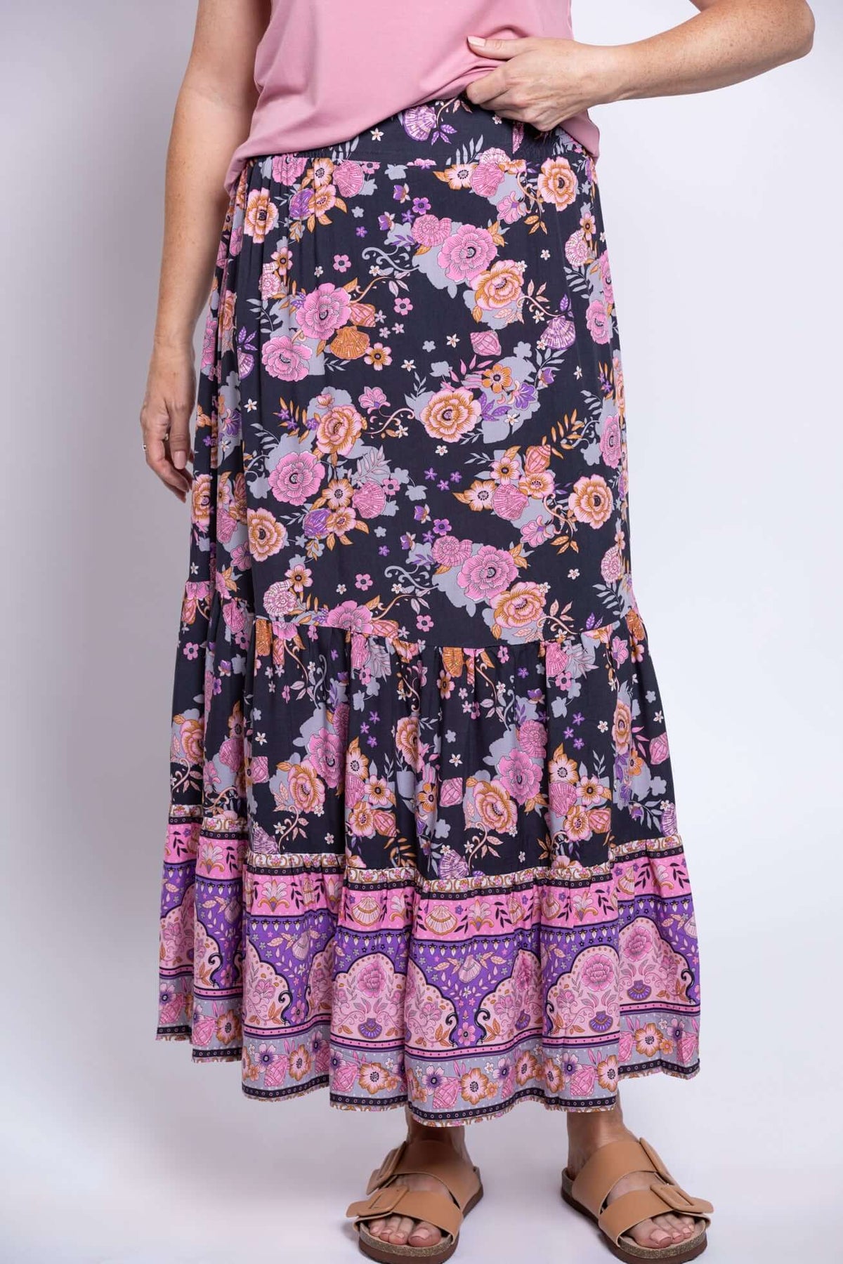 Close-up of Tibby floral maxi skirt with tiered sections and vibrant pink and purple prints