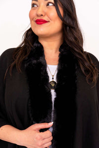 Close-up of faux fur collar on black wrap