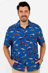 Close-up of man wearing a blue shirt with colorful monster truck print