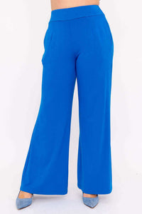 Close-up of blue wide-leg pants with elastic waist and pockets