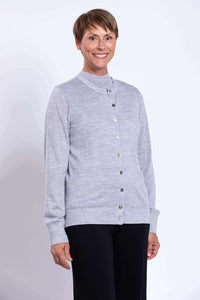 Close-up of a woman in a light grey merino wool crew neck cardigan