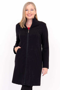 Close-up of woman in Tracy Coat featuring princess seams and zipper