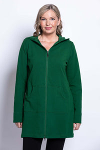 Woman in a green hooded jacket with front zipper and kangaroo pockets, close up