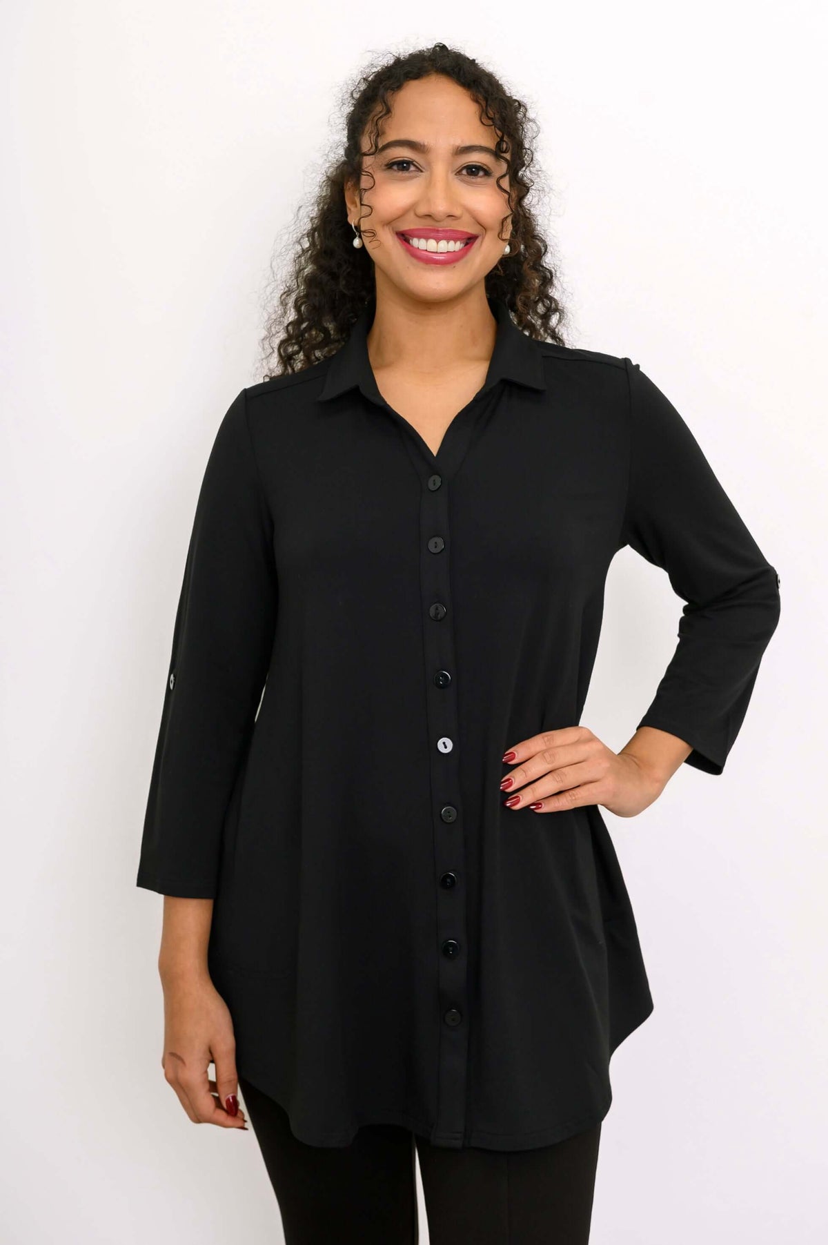 Close up of woman smiling in black bamboo French terry blouse-jacket