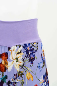 Close-up of the wide knit waistband on Landon Capri floral pants
