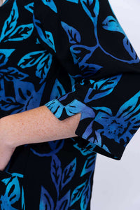 Detailed view of the notched cuff on the 3/4 sleeve of the Evelyn Top