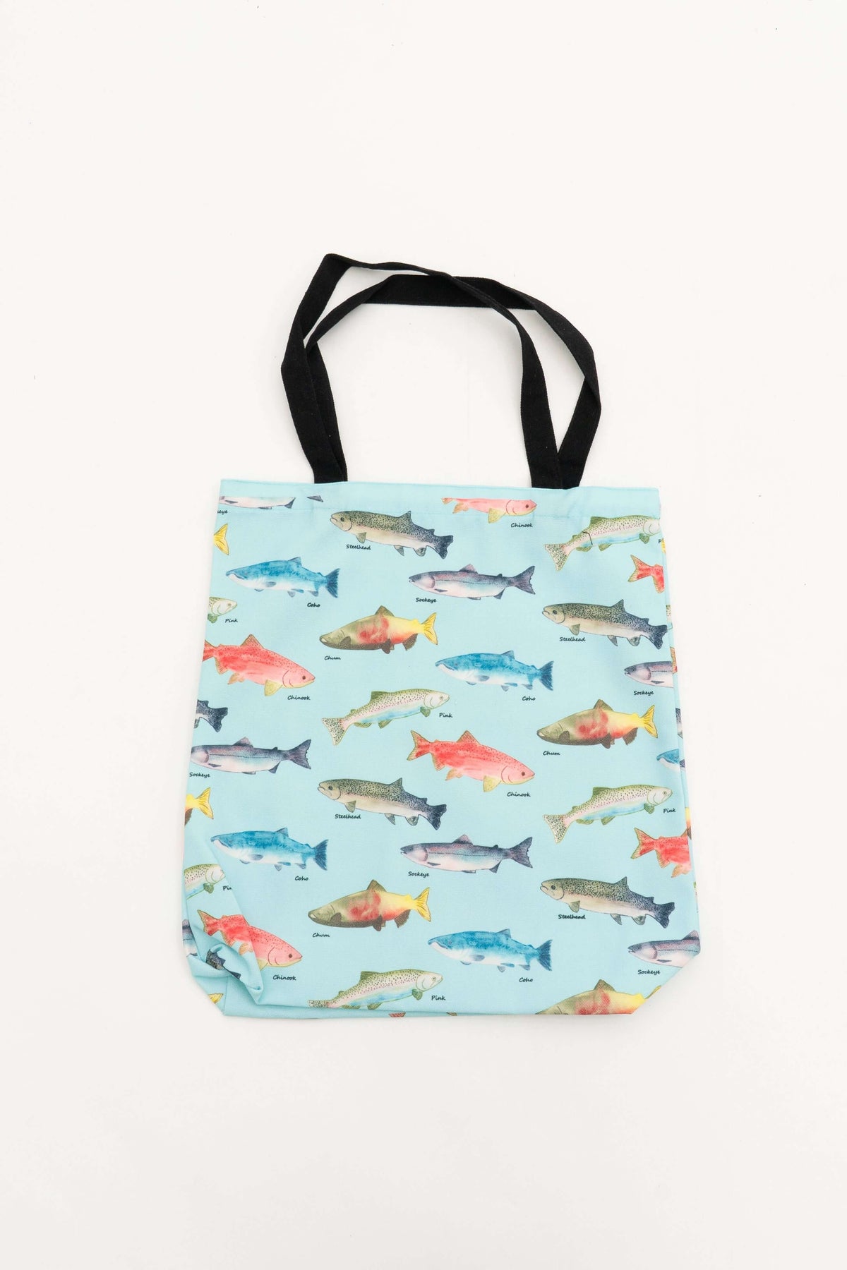Reusable cotton canvas tote bag with colorful fish illustrations and black handles