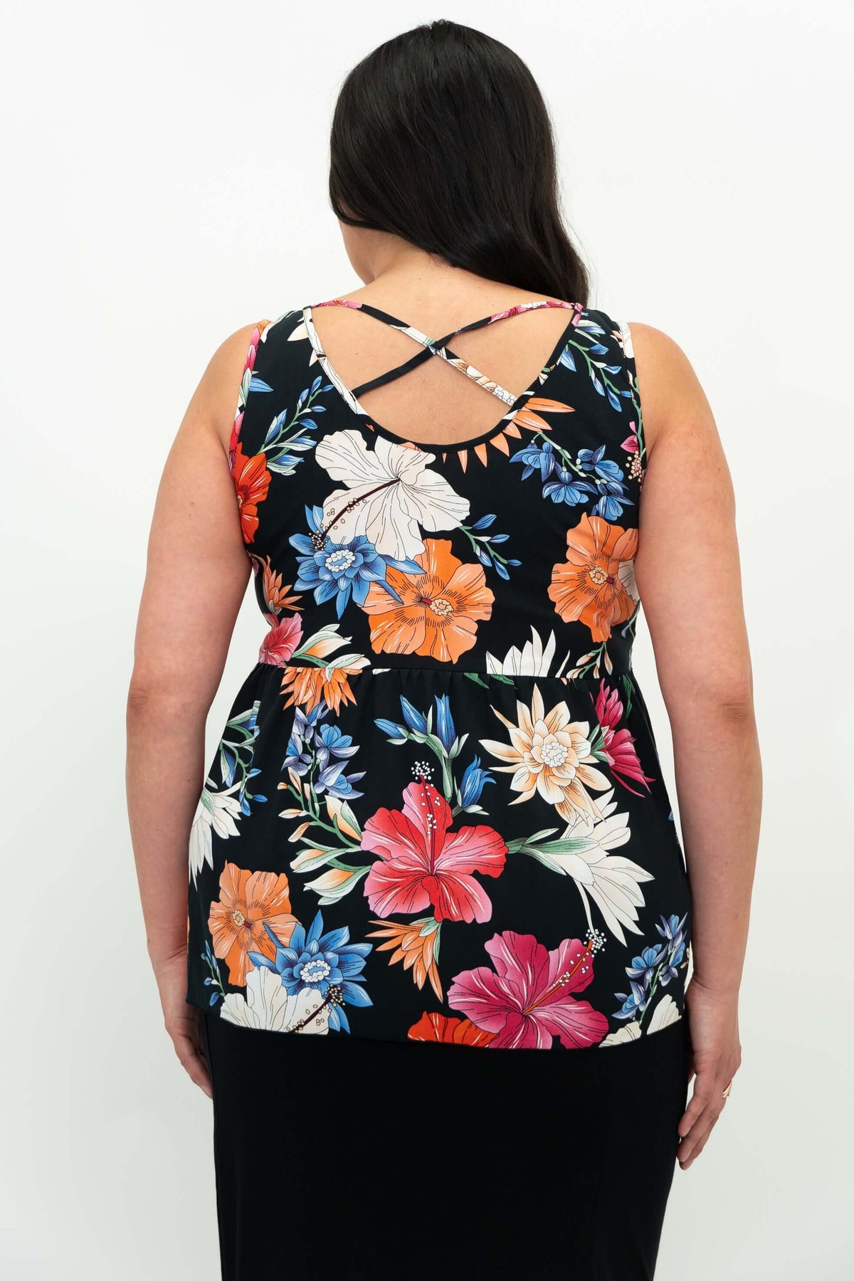 Back view showing criss cross detail of floral tank top on woman
