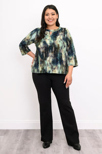 Full-body shot of a patterned green knit top with 3/4 bell sleeves and black trousers, showing the hip-length hem.