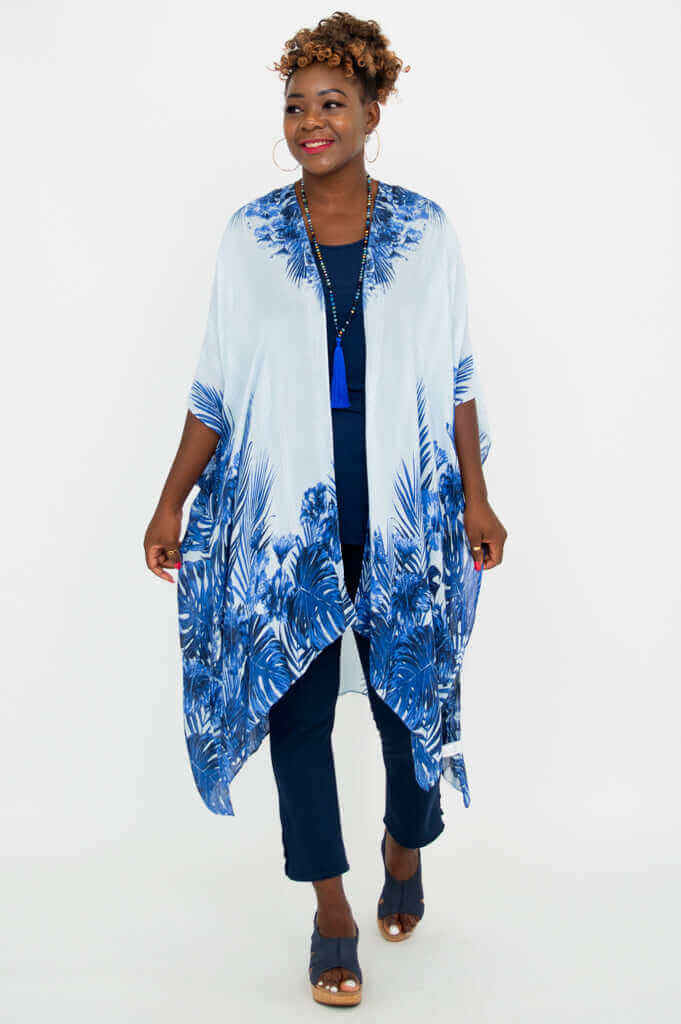 Woman wearing indigo palm Darcy kimono wrap, smiling forward
