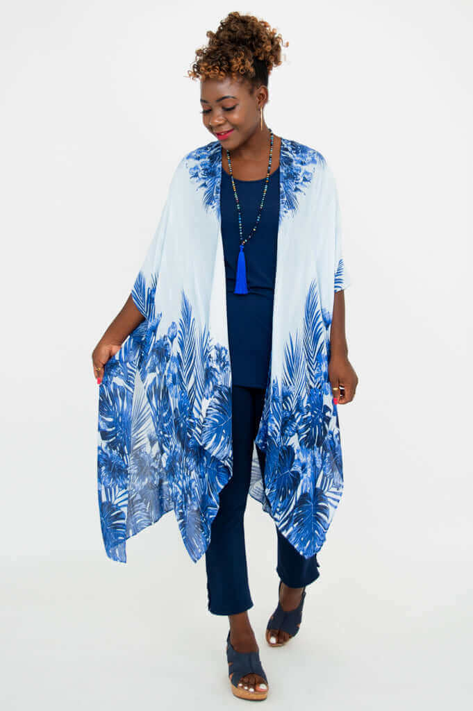 Woman walking in Darcy kimono wrap with indigo palm pattern, looking down