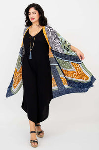 Model swirling to showcase Darcy kimono wrap's vibrant pattern