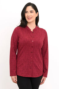 Women's long-sleeve patterned red pullover tunic with button closures and a mandarin collar, front pose.