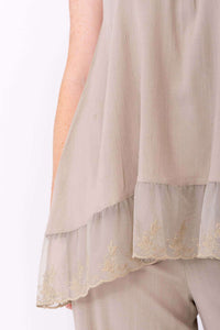 Close-up detail of Chantilly Lace Tank's embroidered lace hem