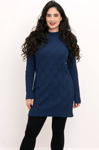 Front view of a woman wearing a vintage indigo blue diamond cable knit cotton sweater tunic.
