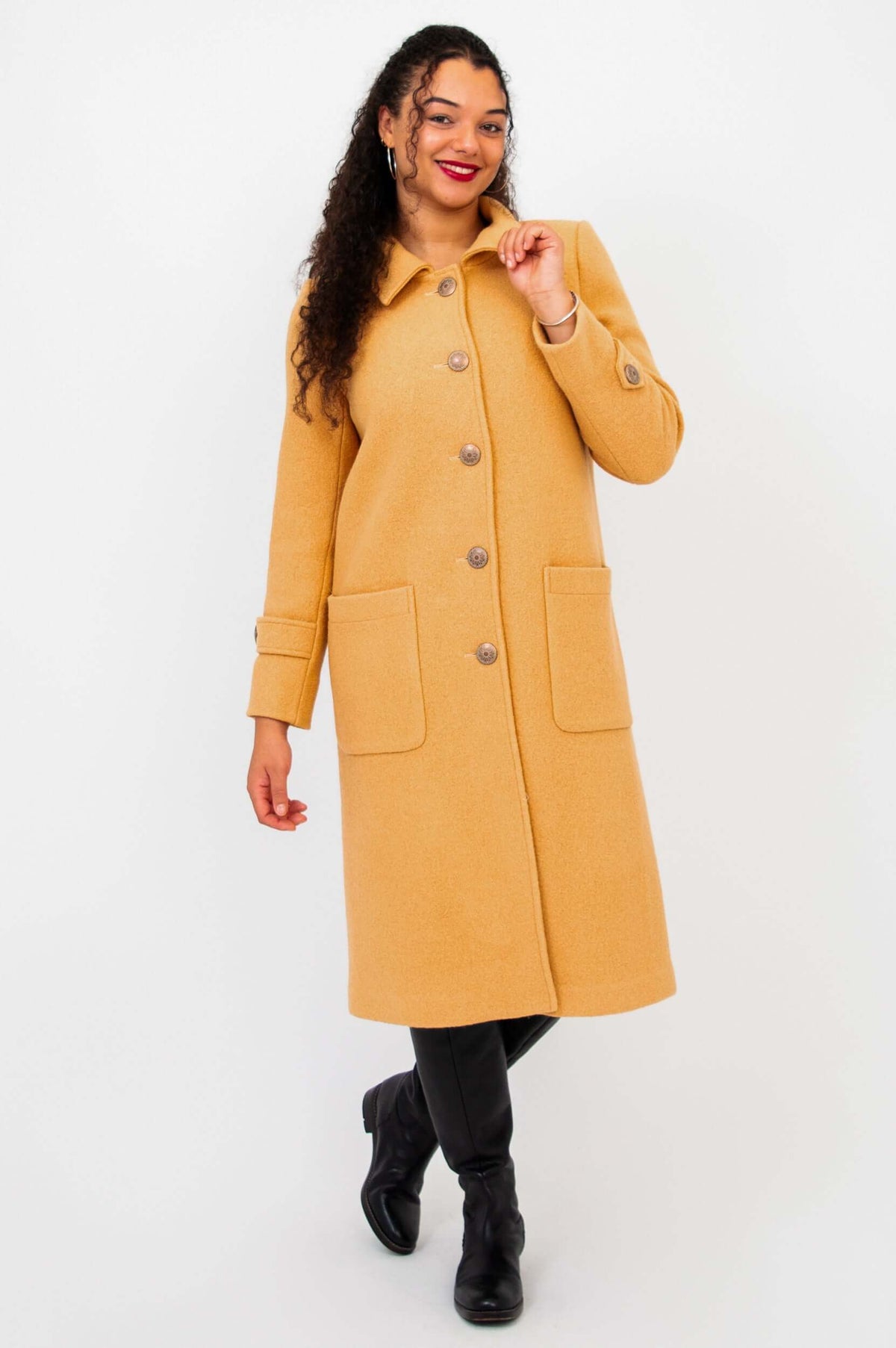 Model posing in the Edna wool blend coat with a turned collar