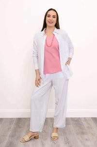 Model styling Boardwalk Pants with pink top and open white shirt