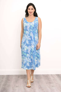 Front view of model in blue watercolor tank dress and white sandals