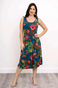 Woman posing with hand on hip in teal floral tank dress, front view